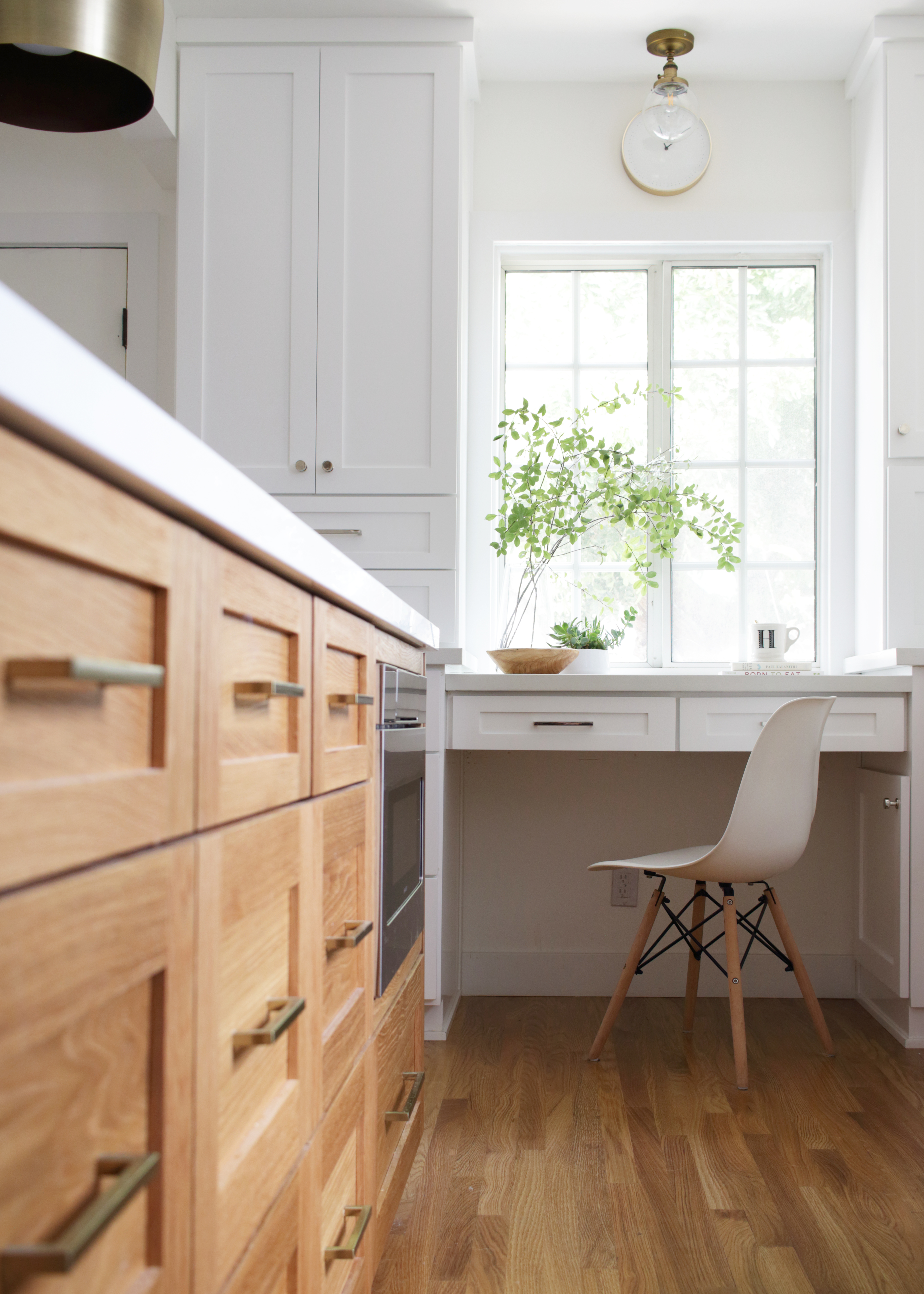 LA white kitchen with oak flooring